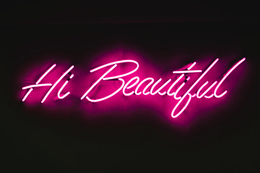 pink neon sign that says "Hi Beautiful" 