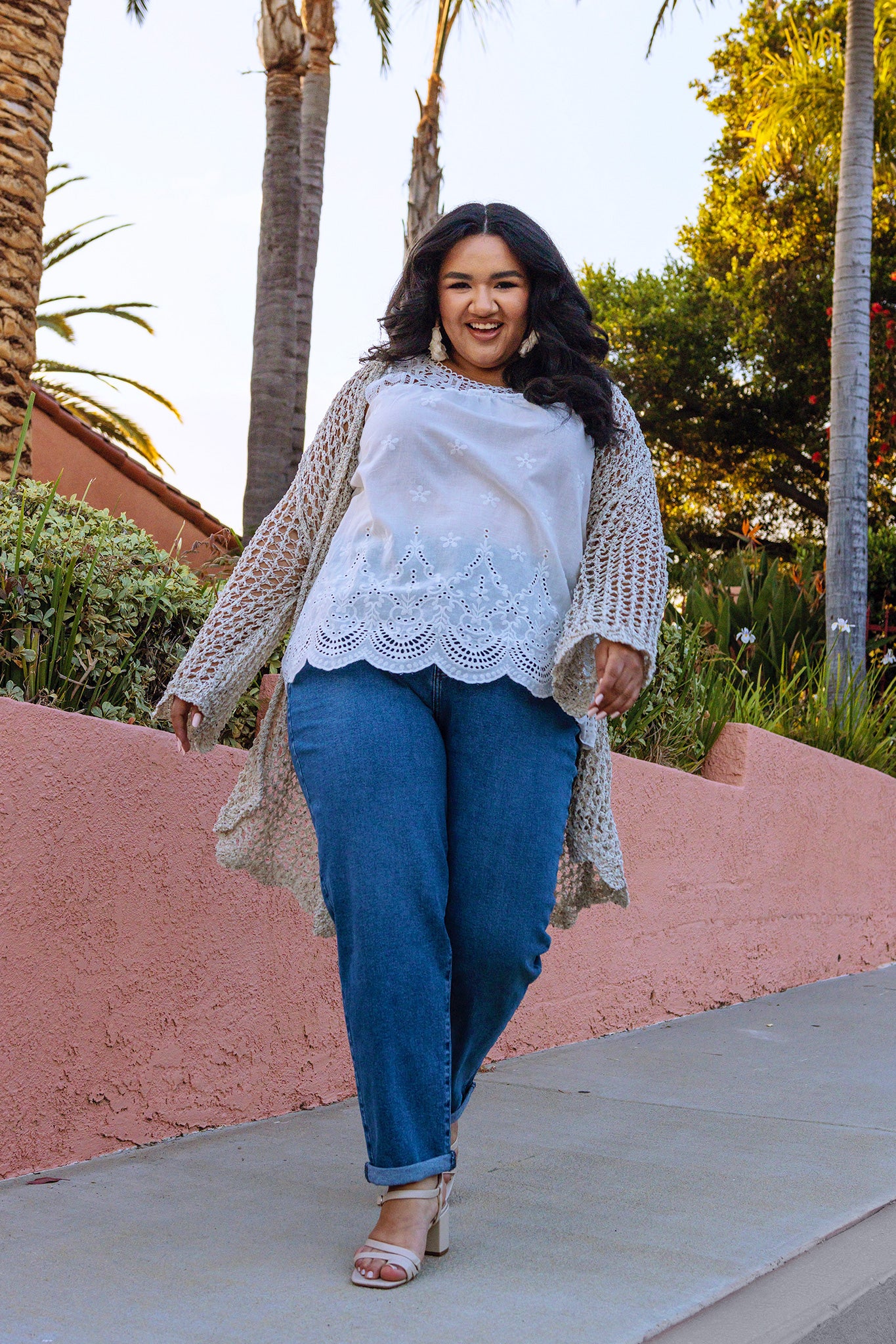 Laguna Open Knit Crochet Kimono on model on a palm-tree lined street- Belle and Broome