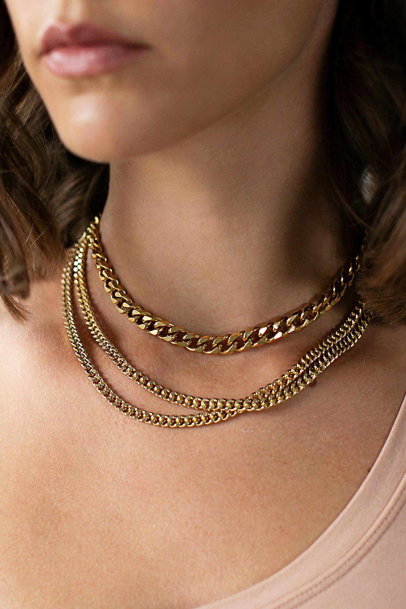 Giselle Thick Gold Chain Necklace with smaller chains on model