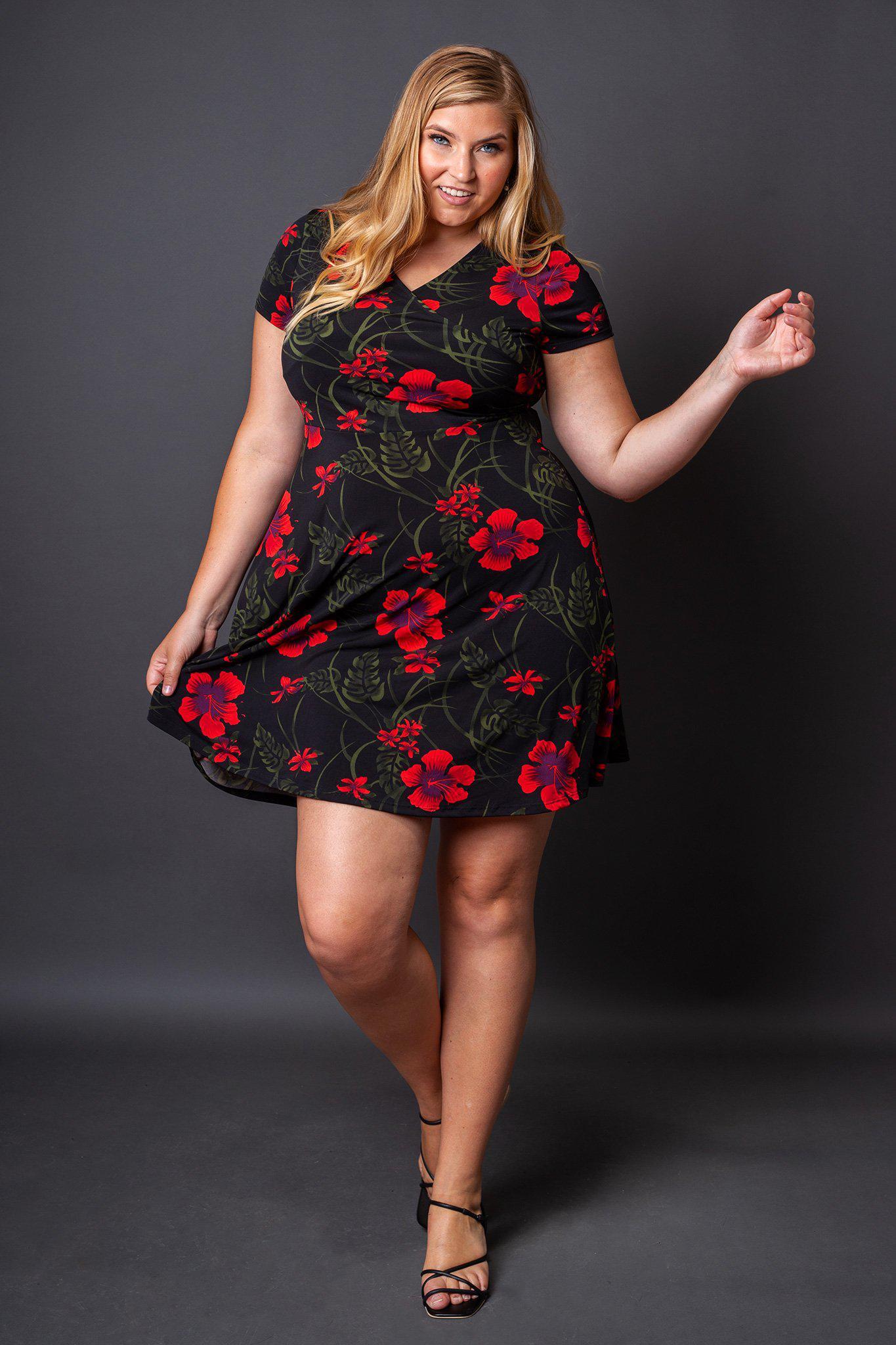 Holly Fit and Flare Floral Dress front view on model kicking her leg up