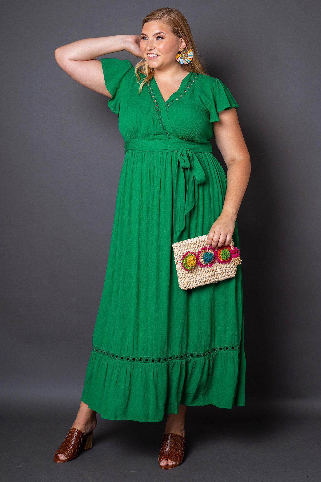 Kelli Green Maxi Dress Plus-Size on Model Holding Clutch Bag