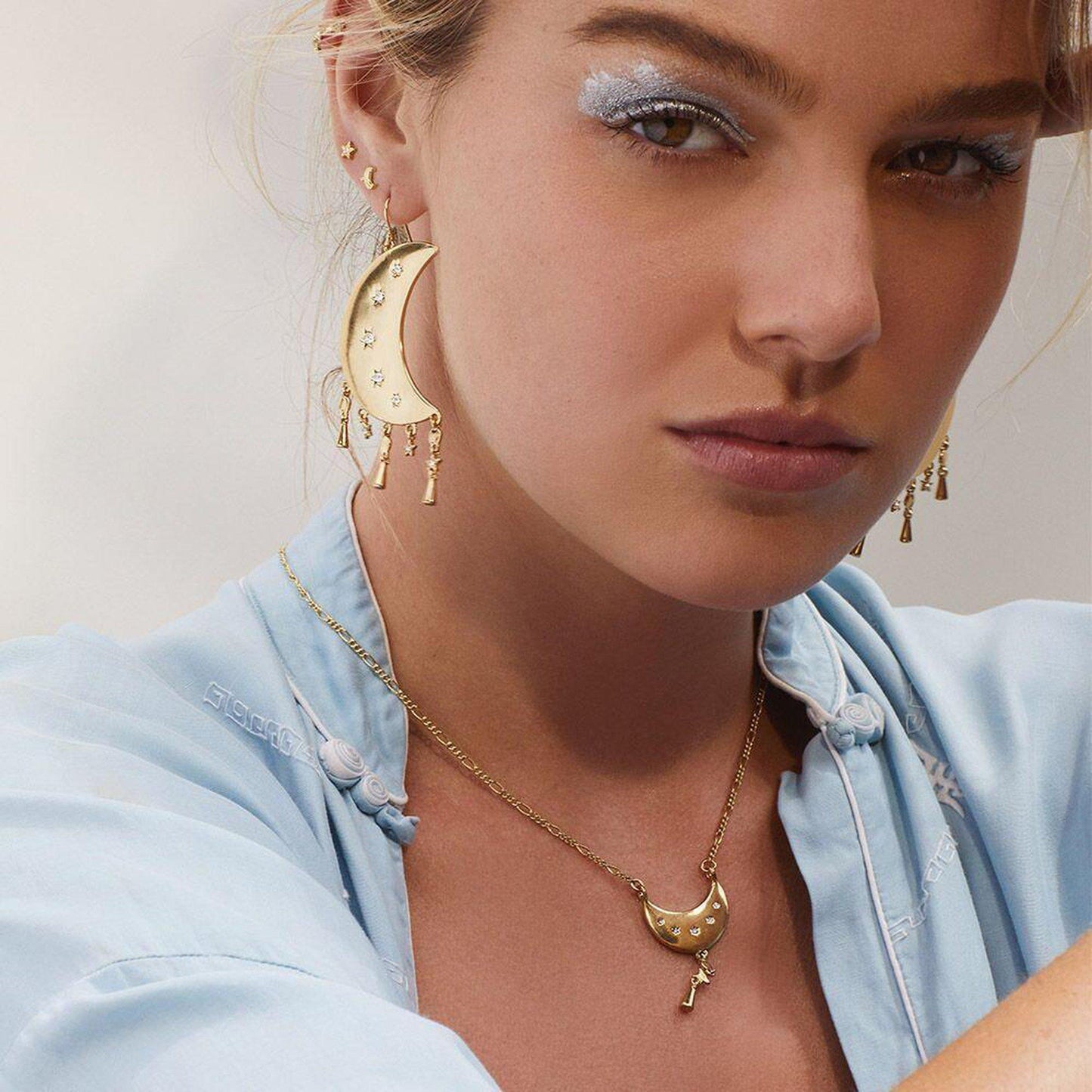 Luv AJ Celestial Statement Moon Earrings in Gold on model dramatic look with matching necklace